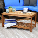 Light brown, slatted coffee table with a blue couch in the background.